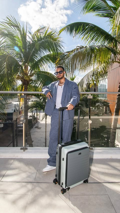 Instagram post by @septembermondays for LEVEL8. Caption reads: Outfit of the day — carry-on included.....