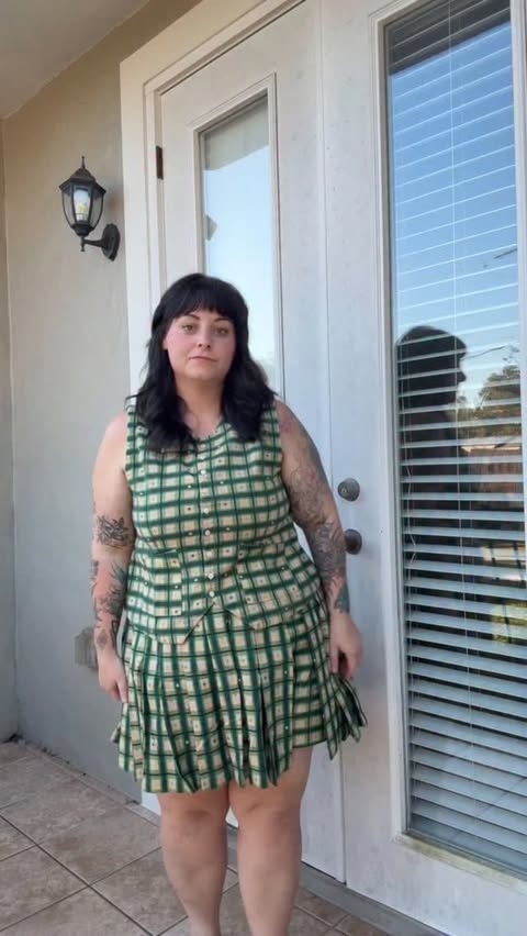 Instagram post by @thecurvycapsule for Shop Noble. Caption reads: @shopnoble new holiday plaid is live!! I’m wearing....