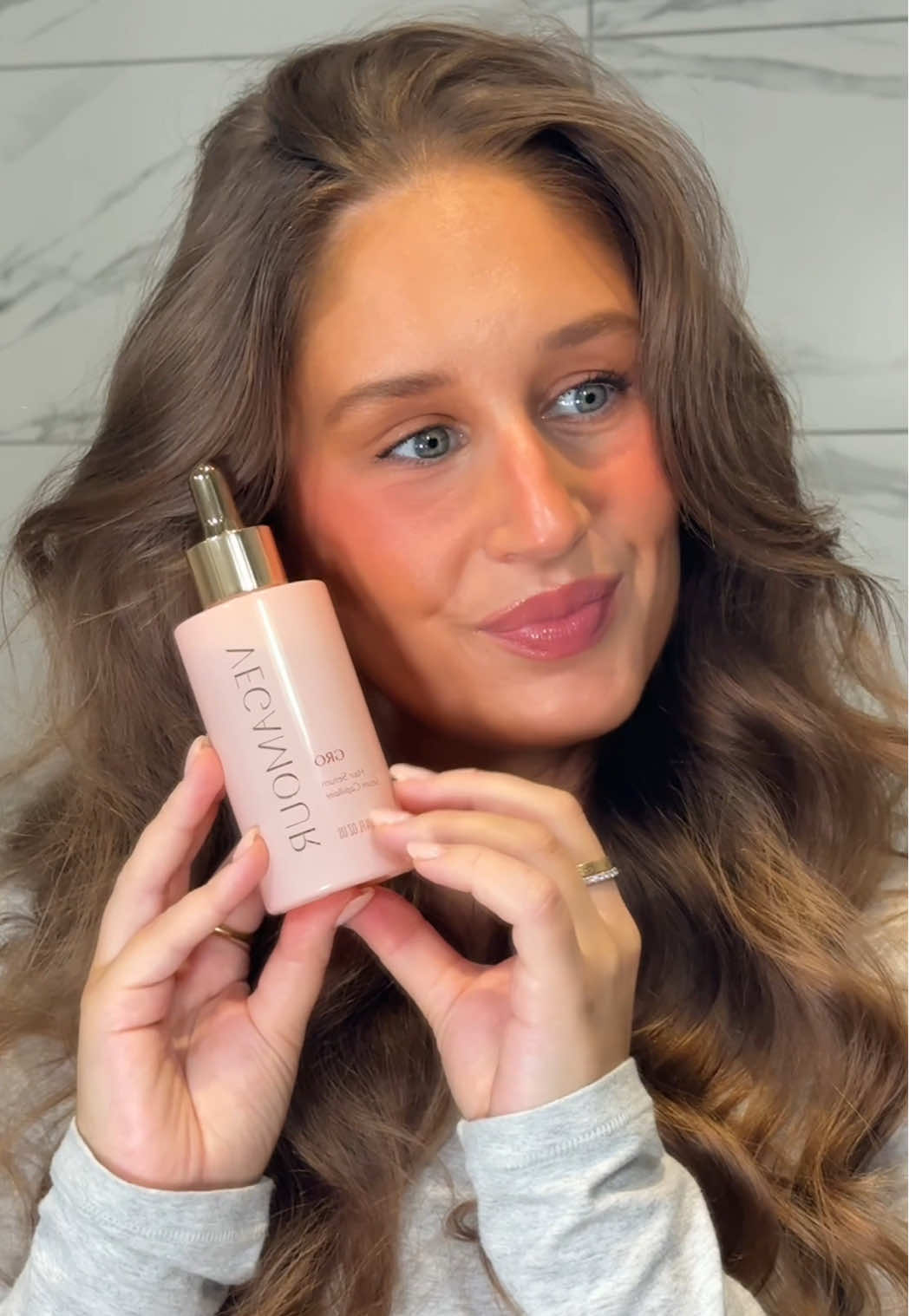 TikTok post by @by.emmaleah for VEGAMOUR. Caption reads: I’ve been obsessed with @VEGAMOUR’s number 1 best....