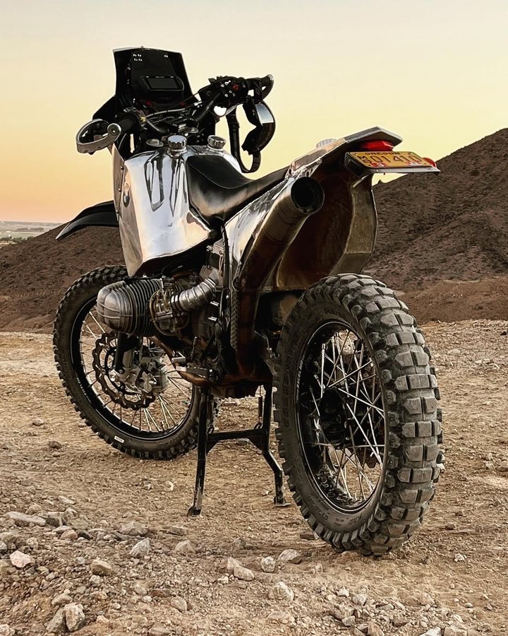 Instagram post by @gregorhalenda for Biltwell. Caption reads: The swingarm has been cut, pivot moved,  braced,....