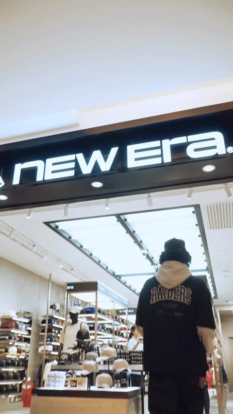 Instagram post by @danfleischer for New Era Cap. Caption reads: Fitted caps are so back! Would you rather: A. Walk....