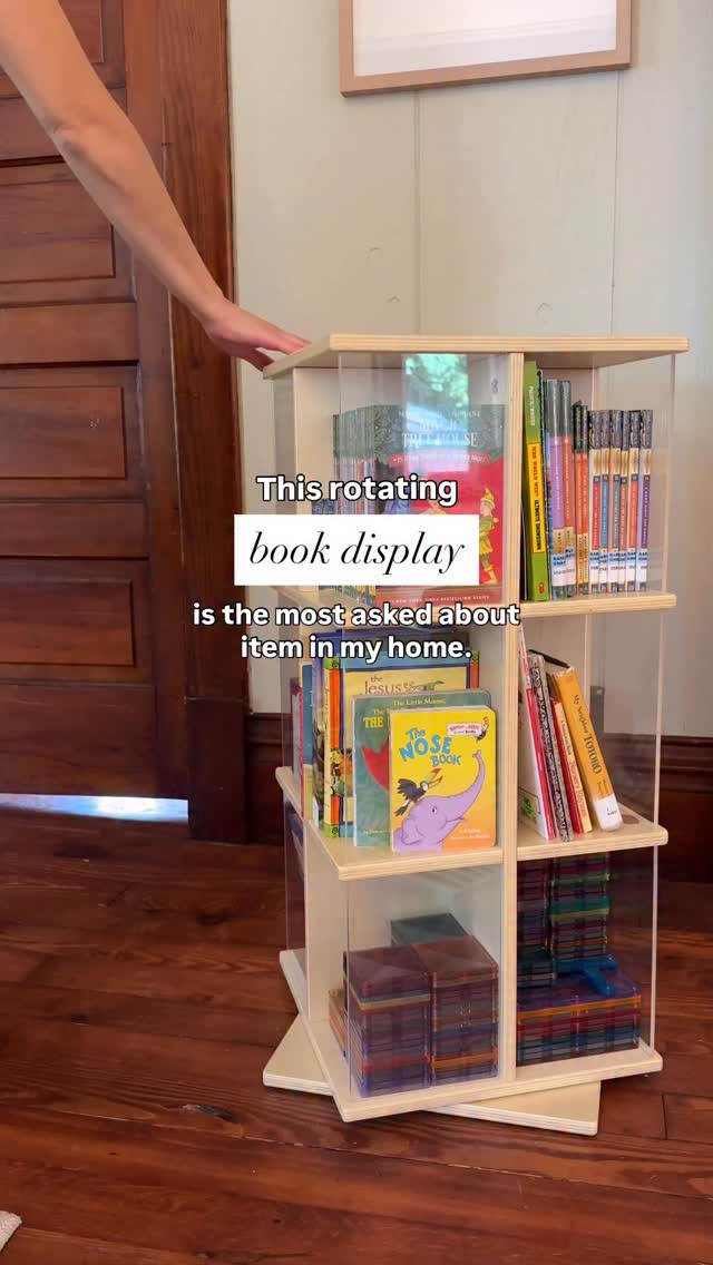 Instagram post by @a.calm.mom for Guidecraft. Caption reads: 📚🧸 Comment “display” for the link and a discount....