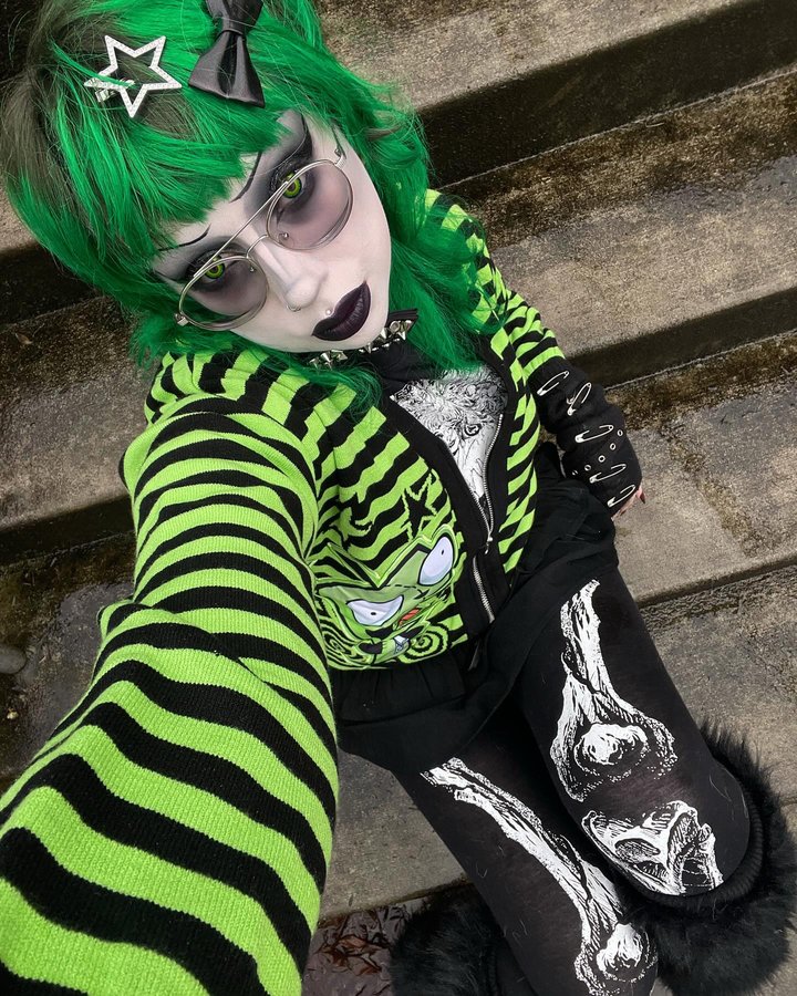 Instagram post by @kryptglow for Spirit Halloween. Caption reads: [...] Bow tie and leg warmers: @spirithalloween....