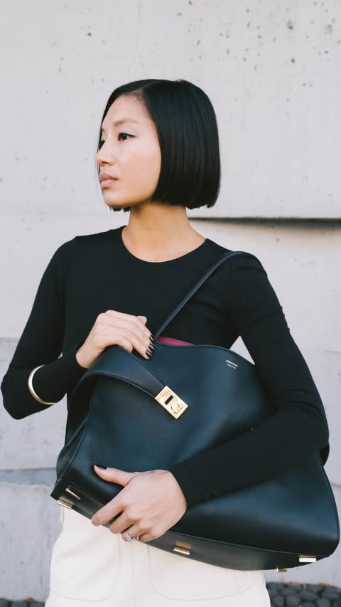 Instagram post by @imogenkwok for FERRAGAMO. Caption reads: [...] piece acts as an extension of my hand....
