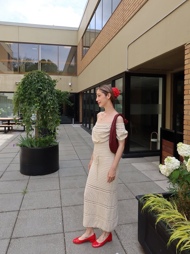 Instagram post by @mel.zzie for JustFab. Caption reads: [...] crochet dress, flower hair lip Shoes....