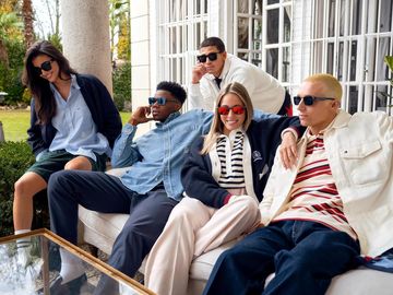 Instagram post by @emilio_sakraya_ for Safilo Group. Caption reads: Coming together is a beginning @tommyhilfiger....