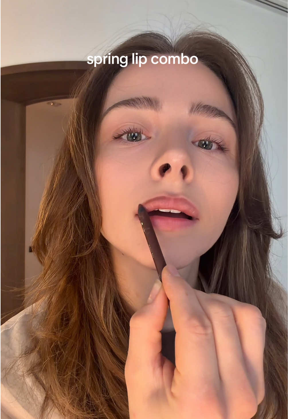TikTok post by @chloegmoretz for Godmode Beauty. Caption reads: [...] combo for spring? groundbreaking @GODMODE....