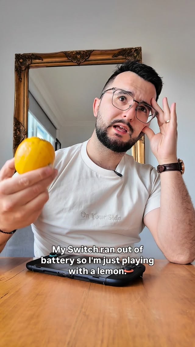 Instagram post by @kostagenaris for Belkin. Caption reads: When life gives you lemons… charge your Switch 2....