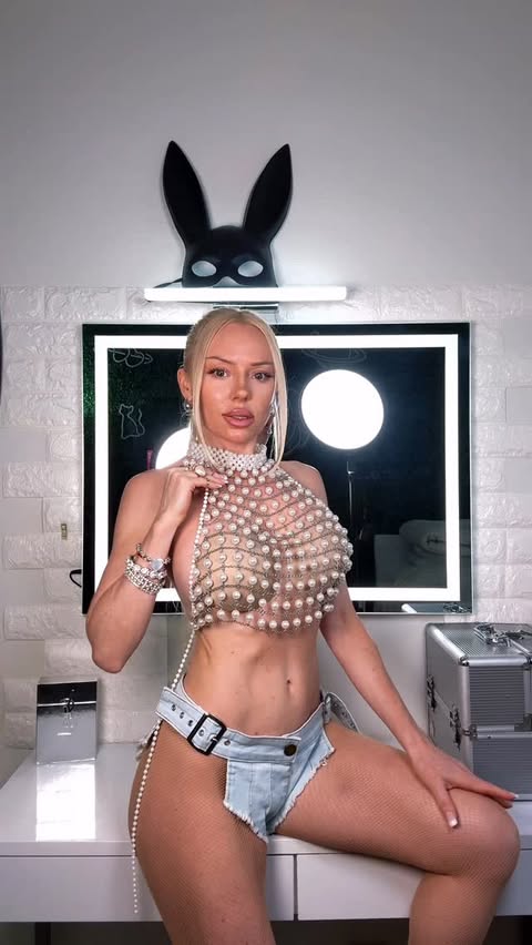 Instagram post by @juliia_bounty for Avidlove. Caption reads: Pearls and denim 🤍 Google Avidlove.com | use code....