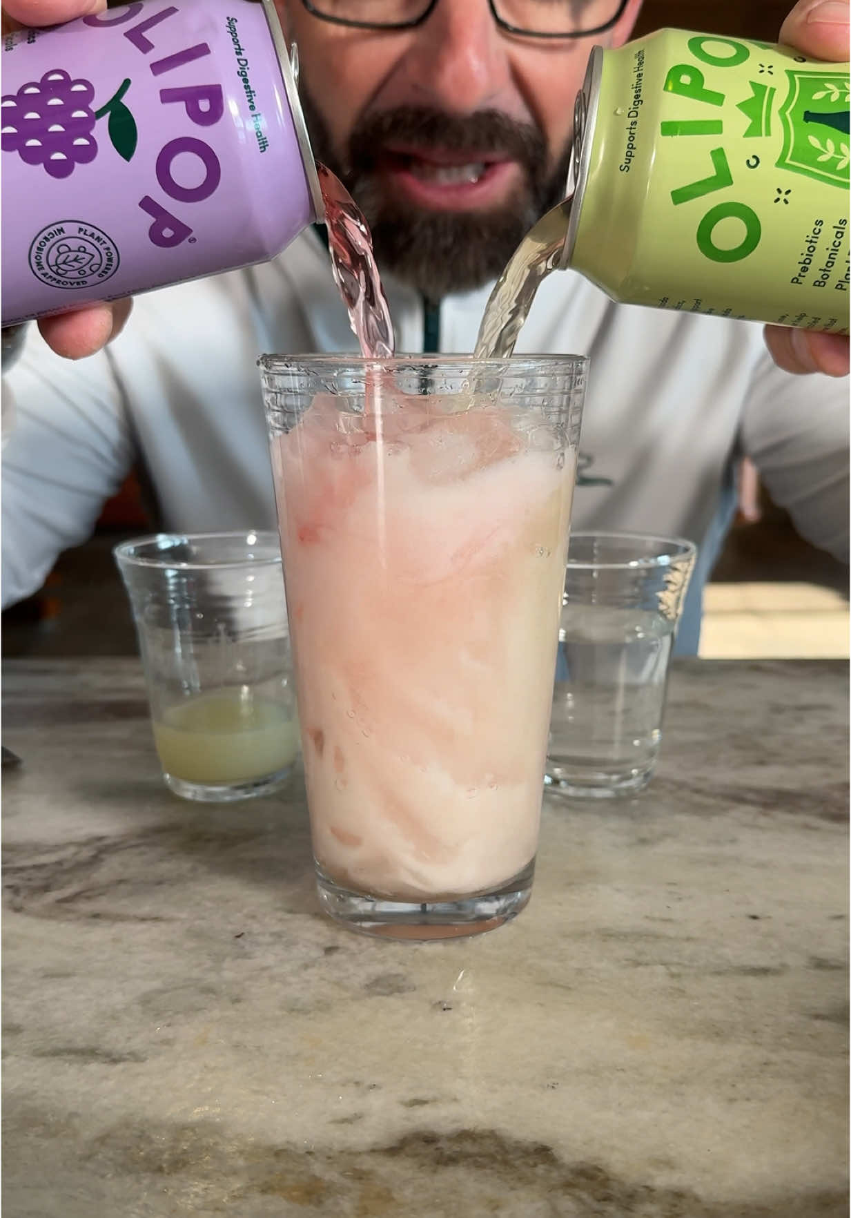 TikTok post by @johnrondi for OLIPOP. Caption reads: [...] is our new go-to.  @OLIPOP #olipoppartner....