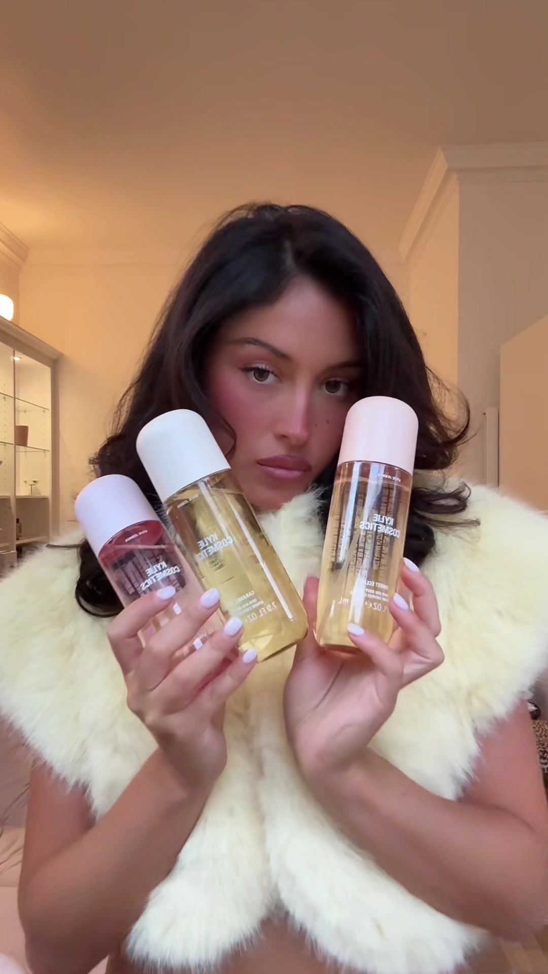 TikTok post by @lianatambini for Kylie Cosmetics. Caption reads: [...] eclair on an evening in autumn @Kylie....