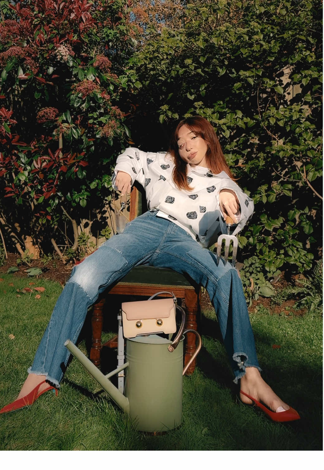 TikTok post by @nikkililly for Marni. Caption reads: a light bit of gardening in @MARNI 🪴👜 #marni ad....