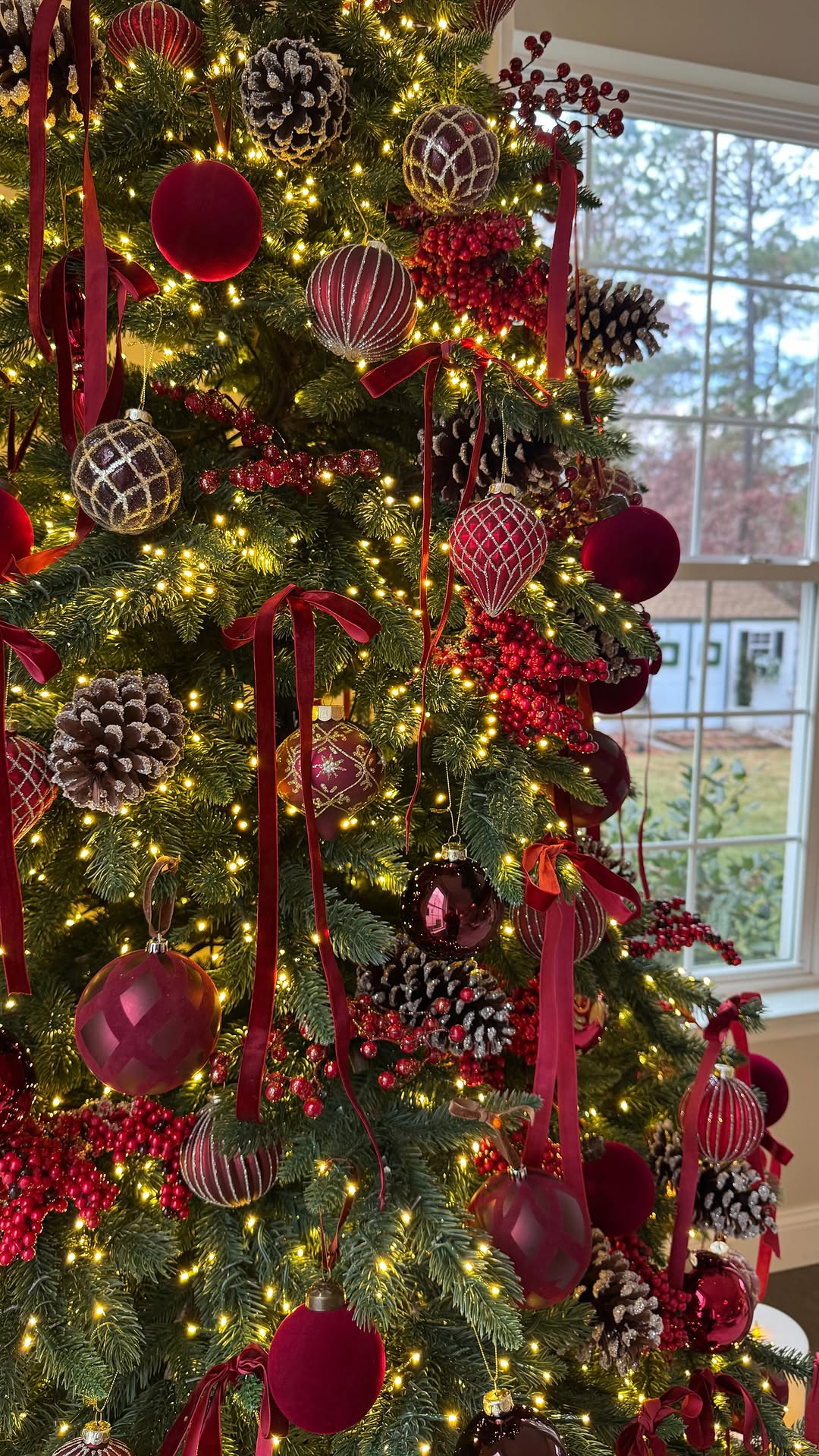 Instagram post by @dressyourdecor for Balsam Hill. Caption reads: Presenting my 2024 red and burgundy tree from....