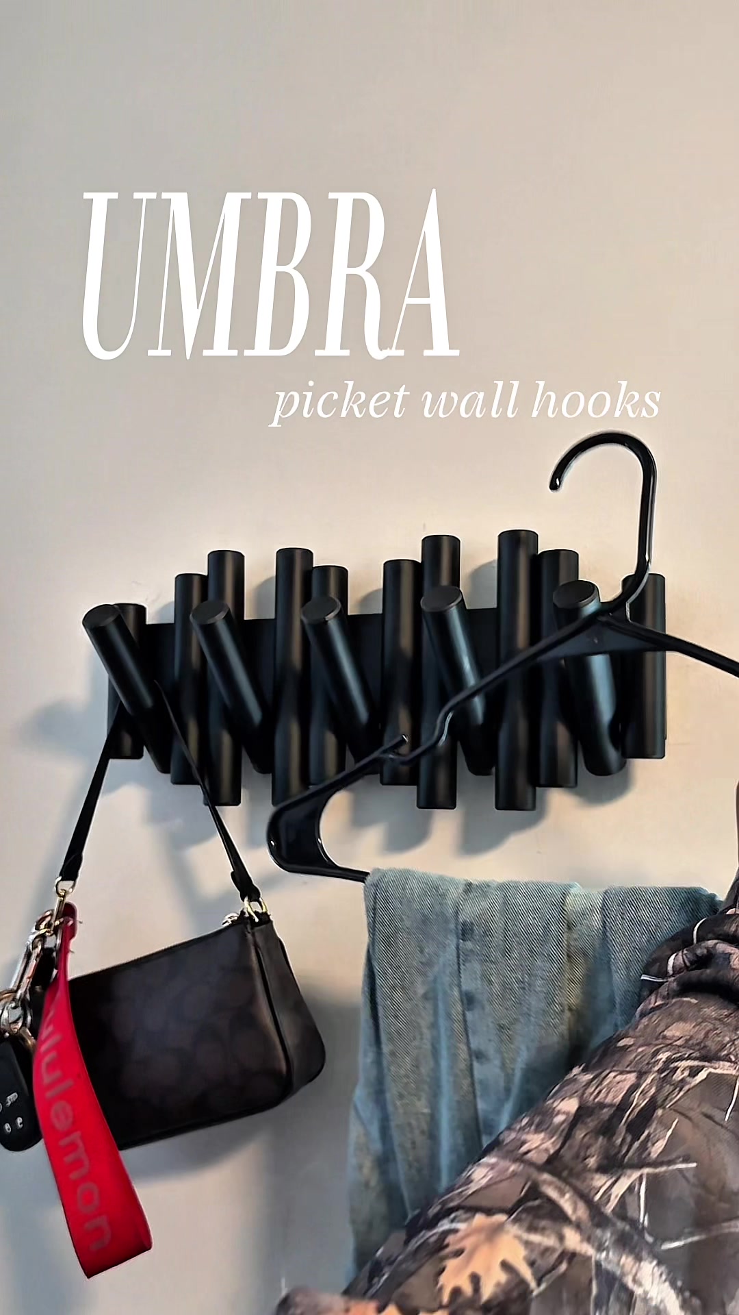 TikTok post by @miyacromer for Umbra. Caption reads: [...] so these picket wall hooks from @Umbra....
