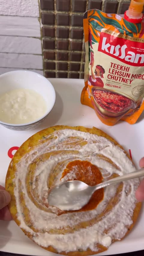 Instagram post by @igastronomist for Kissan. Caption reads: 4 PM cravings fixed 🌶️✨ Khakhra + dahi + Kissan....
