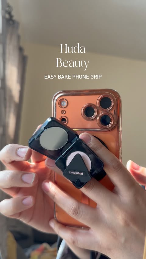 Instagram post by @blog_muzna for HUDA BEAUTY. Caption reads: Huda beauty upgrade easy bake Phone Grip [...].