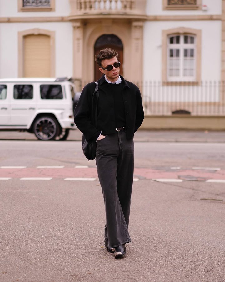 Instagram post by @arnald.lagji for SANVT. Caption reads: A wool sweater is essential and a staple in any....