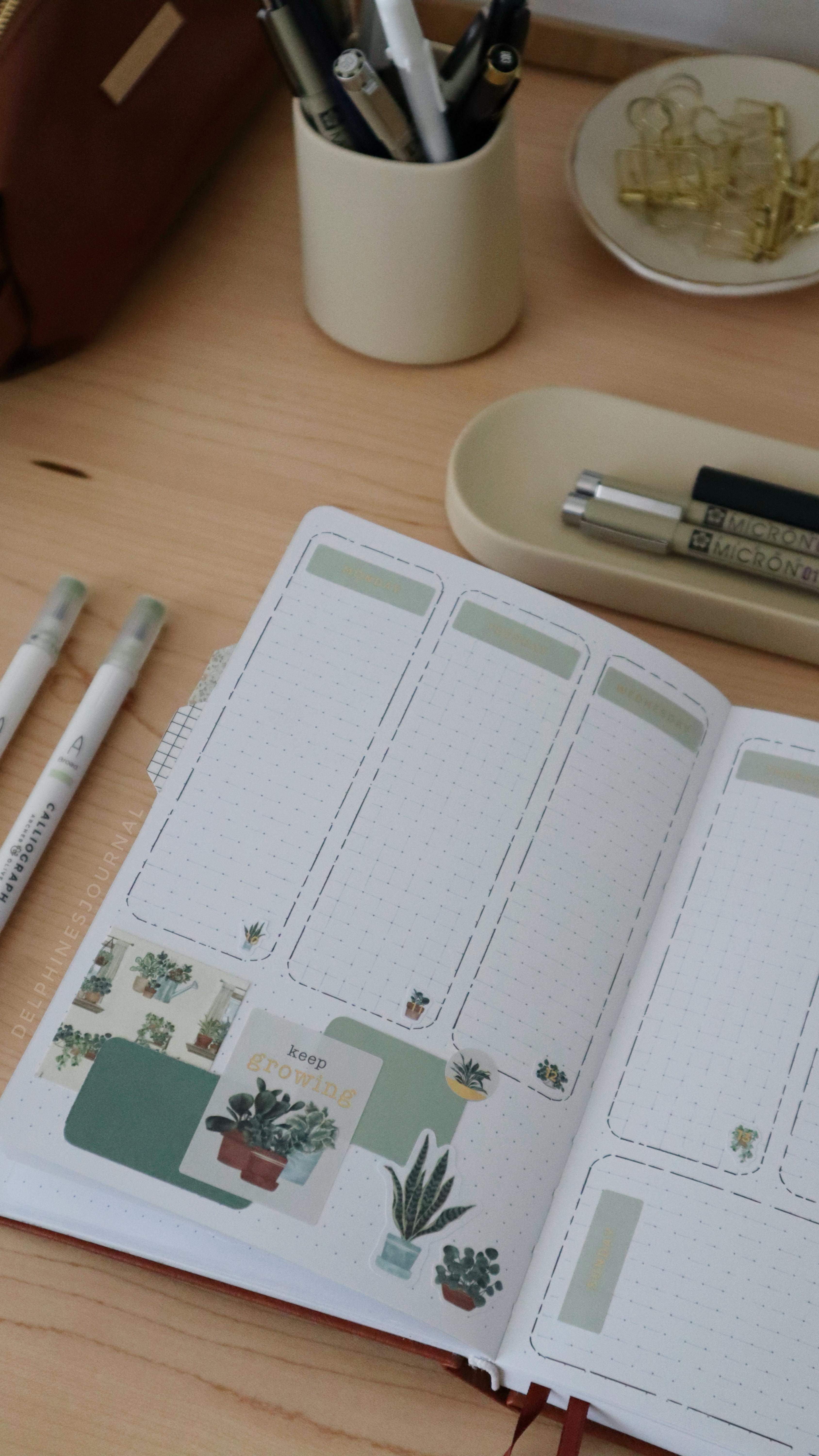 Instagram post by @delphinesjournal for Paperwrld. Caption reads: I had finished this spread but something was just…....