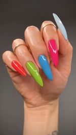 Instagram post by @allisondoesnails for BKIND. Caption reads: some colorful skittle manis on my cindy hand 💅🌈....