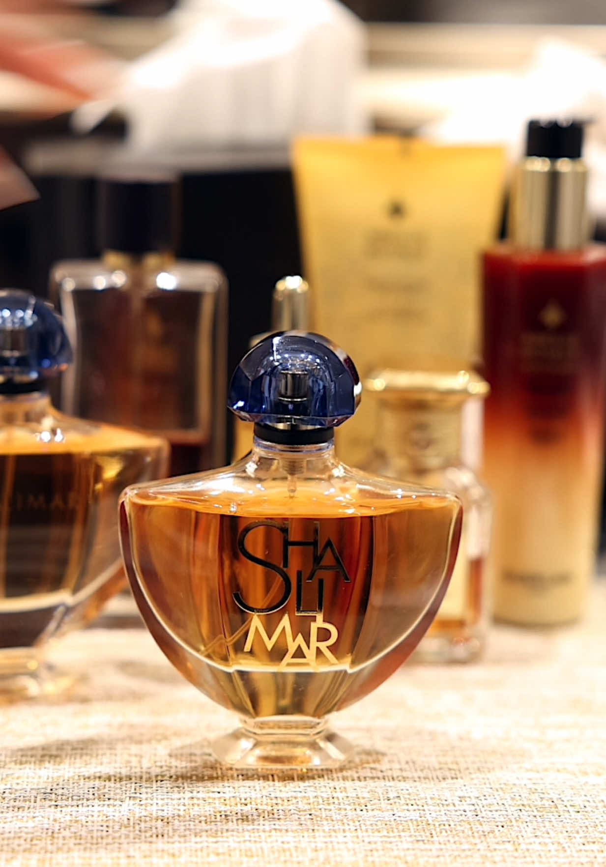 TikTok post by @jackieaina for Guerlain. Caption reads: 24 hours in NYC with @Guerlain celebrating 100....