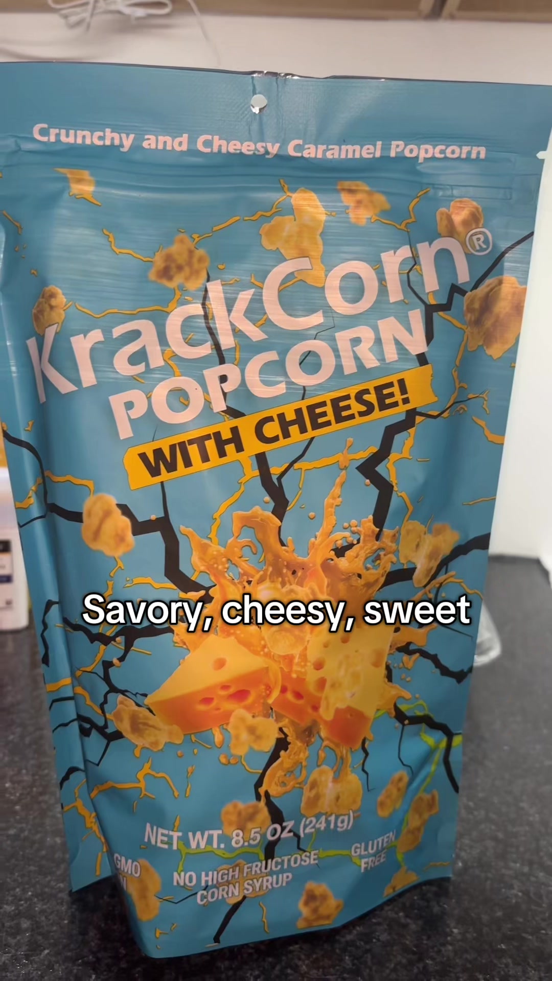 TikTok post by @reina_unger for KrackCorn Popcorn. Caption reads: [...] I’ve been hooked #fyp #foryoupage....