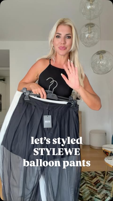 Instagram post by @zajkagenia for stylewe.com. Caption reads: Black & white @stylewe pants 🖤🤍 🔎 11KPA4LE21E....