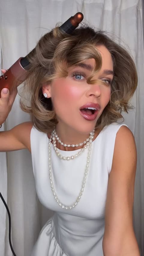 Instagram post by @ginemargrethe for Dyson. Caption reads: Ad. Bobsessed? Holiday hair with love and care....