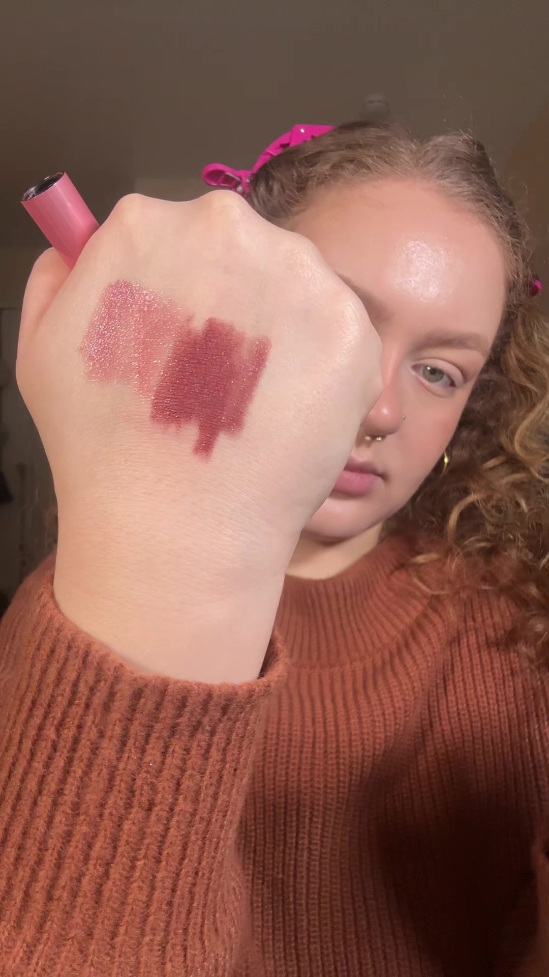 TikTok post by @isabella.rose.vega for About-face Beauty. Caption reads: about-face shimmer stick in shade “heart on fire”....