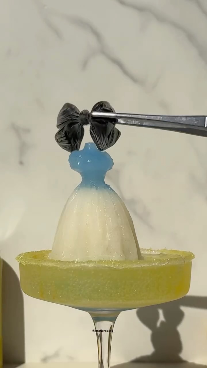 Instagram post by @estherscafe_ for Sparkling Ice. Caption reads: ⏱️🎀 alice from alice in the wonderland inspired....