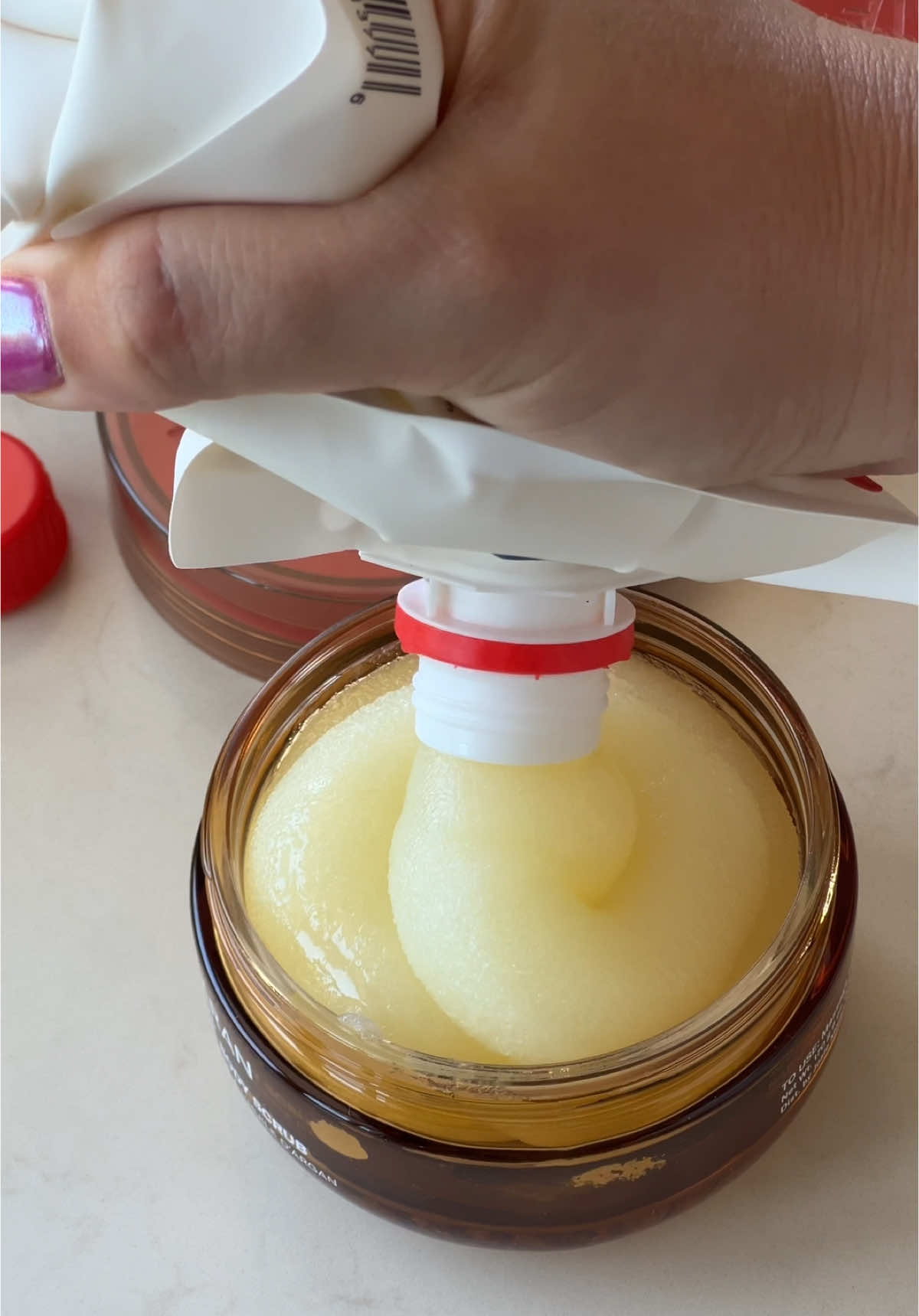 TikTok post by @alirosegray for Josie Maran. Caption reads: re-filling my @Josie Maran body care 🍦🤍🍨....