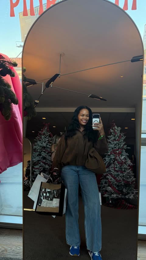 Instagram post by @arnell.armon for Touchland. Caption reads: Looking for a cute and useful holiday gift? I got....