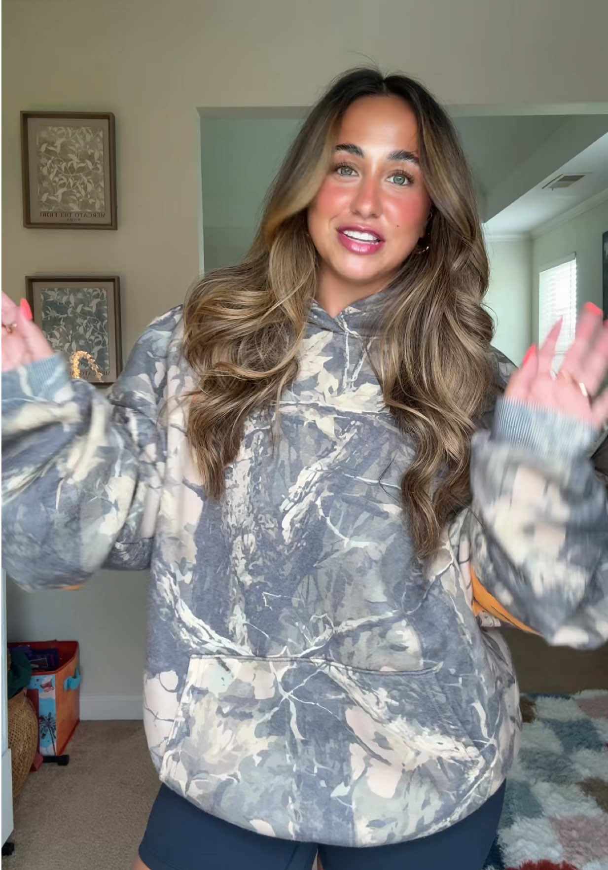 TikTok post by @_alexisrankinn for God's Love Overcomes. Caption reads: THE BEST HOODIE TO EXIST 🤎✨🫶🏻@God’s Love....