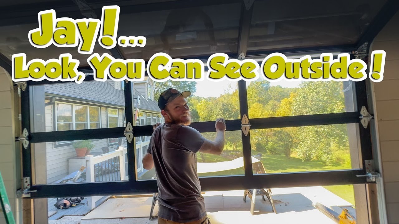 YouTube post by @Building_Jays_Way for RealTruck. Caption reads: GARAGE DOOR TIME!! Jay's BIGGEST Project EVER!!....