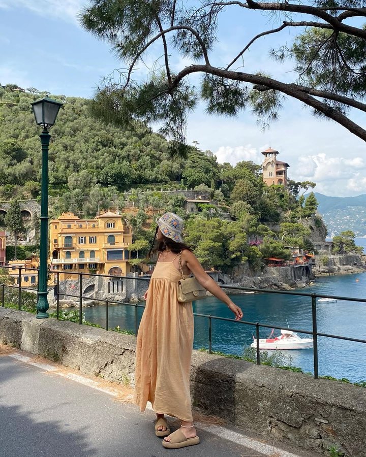 Instagram post by @fvlyacelik for EDITED. Caption reads: a peachy summer day in portofino with....