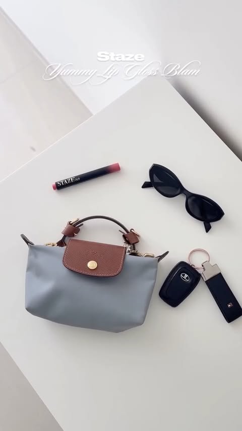 Instagram post by @nyraa__s for Staze Beauty. Caption reads: My bag may change with the season, but my....