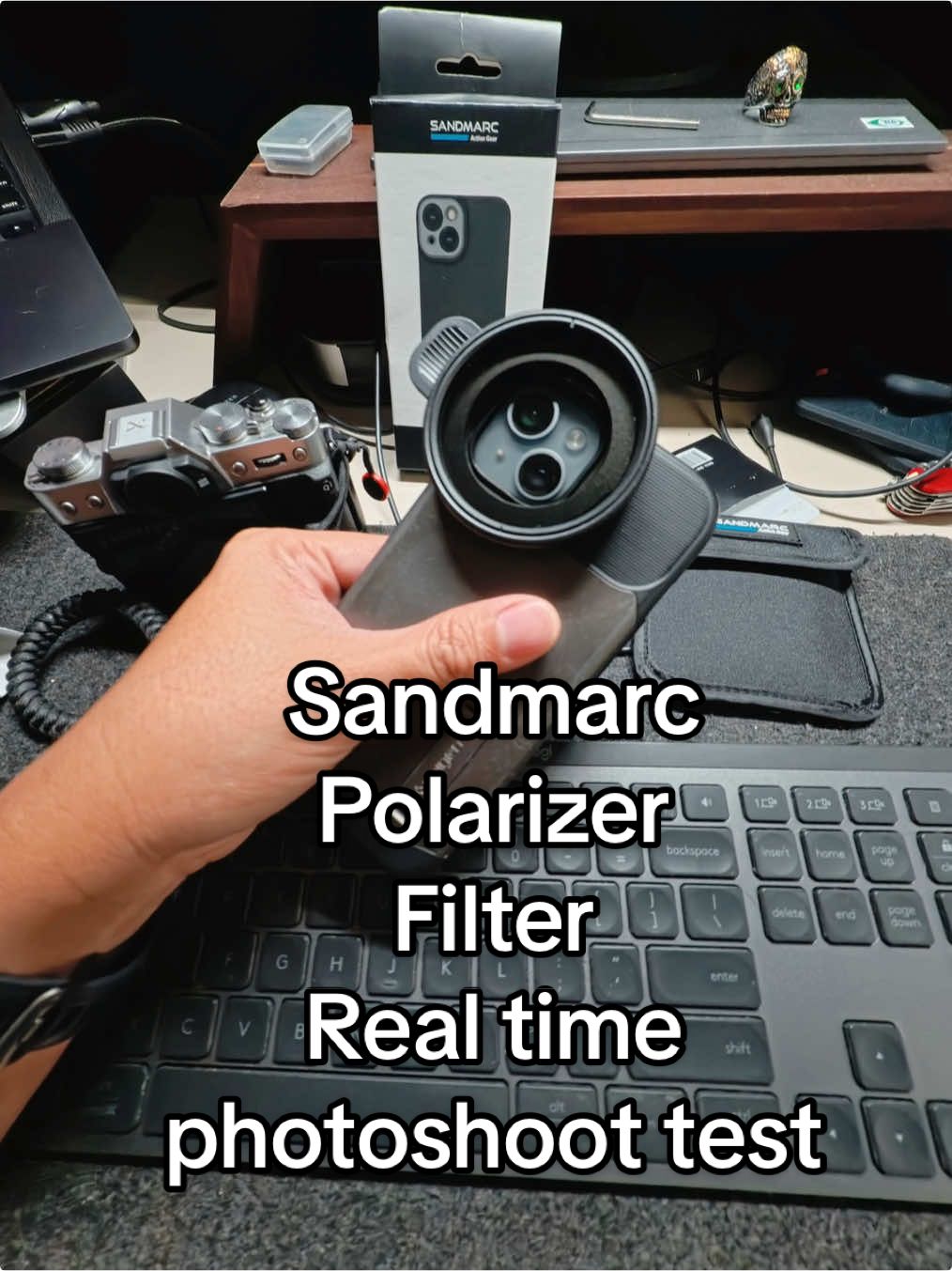 TikTok post by @paperprojectphoto for SANDMARC. Caption reads: POV: Testing the @SANDMARC Polarizer Filter on a....