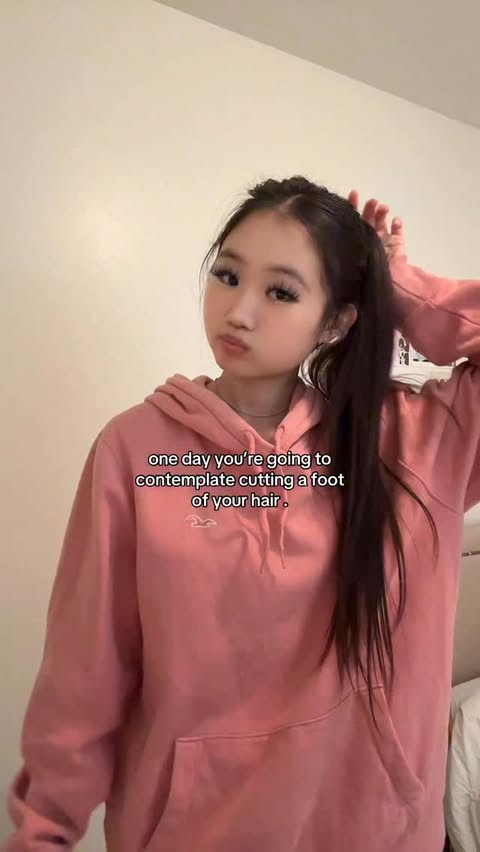 Instagram post by @glowynectarine for hollister. Caption reads: little miss refuses to get a haircut . hoodie....