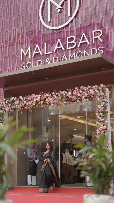 Instagram post by @khushthesia for Malabar Gold and Diamonds. Caption reads: [...] 🎥 - @dreams_production.in....
