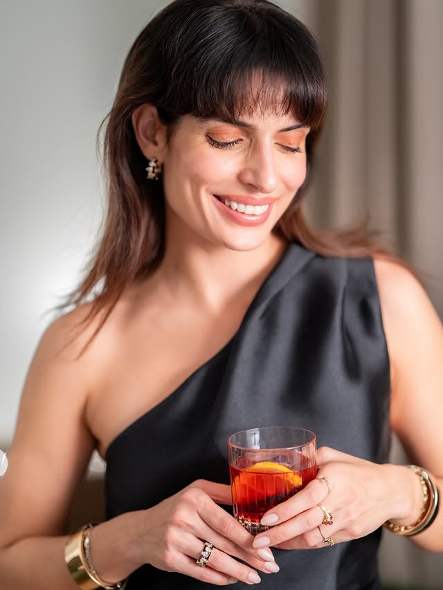 Instagram post by @toniasotiropoulou for Campari. Caption reads: #ad A Red festive story written with....
