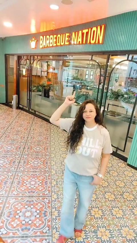 Instagram post by @spicyndtangy for Barbeque Nation. Caption reads: Barbeque nation me 599/- me mil raha hai unlimited....