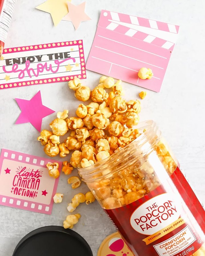 Instagram post by @keriannbritt for The Popcorn Factory. Caption reads: When movie night and National Popcorn Day fall on....