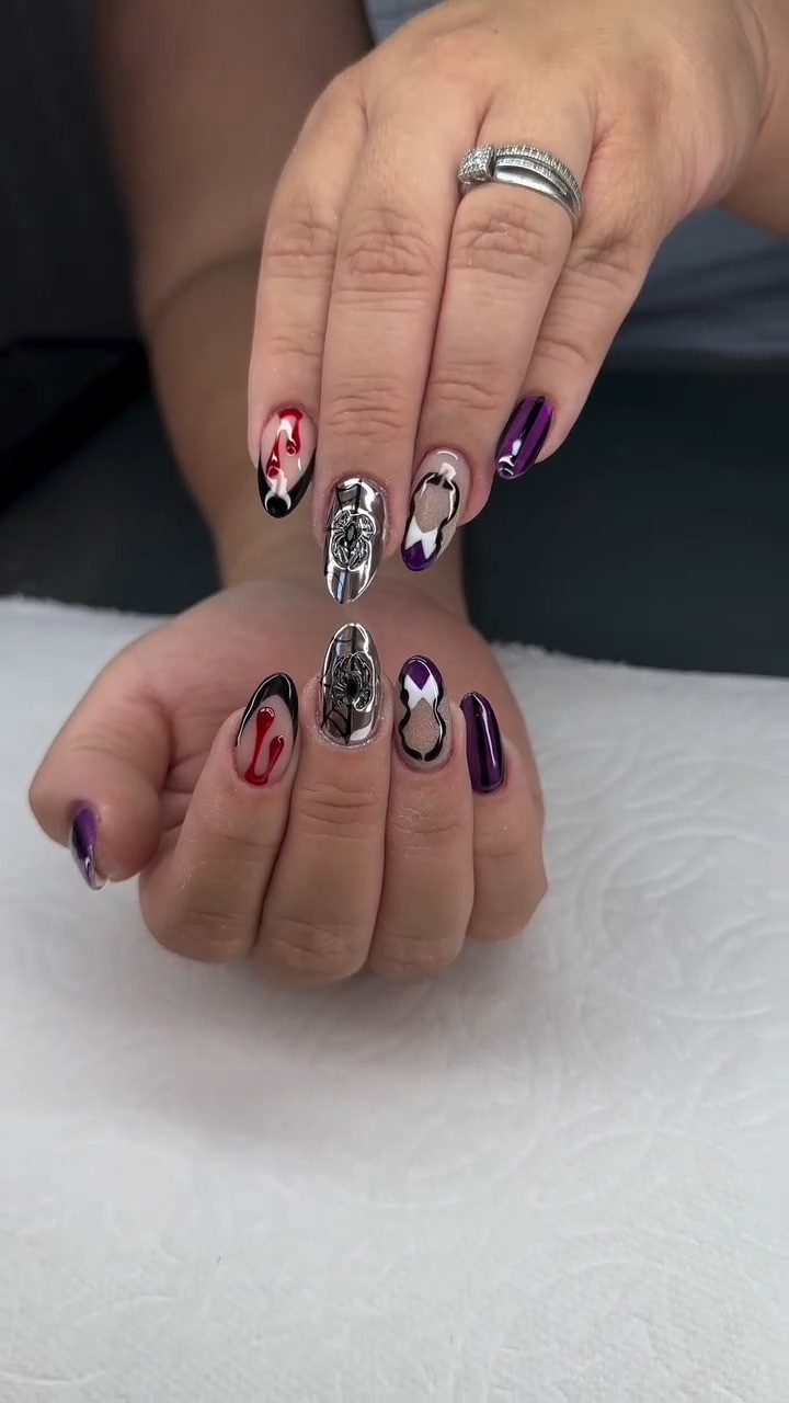 Instagram post by @beetles_community for BeetlesGelPolish. Caption reads: Wednesday Halloween Nails 💅🏻🖤💜
💅Nail design....