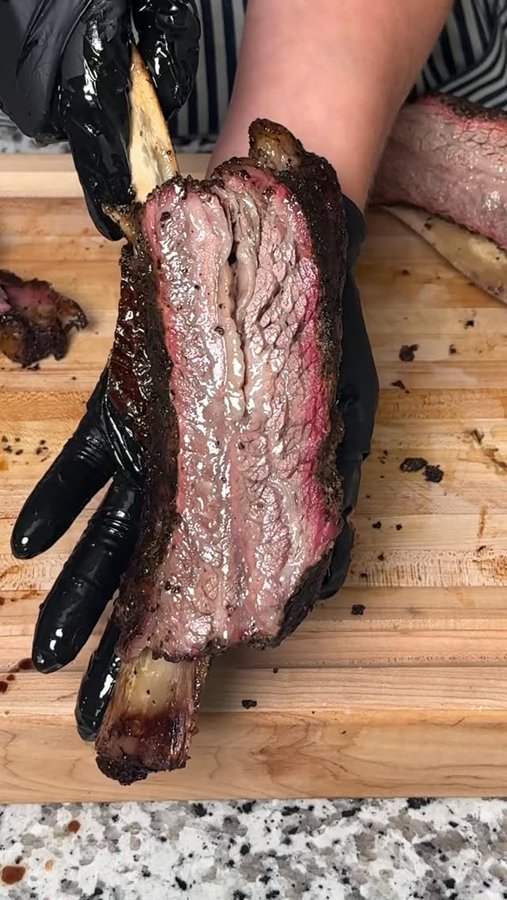 Instagram post by @marriedtobbq for Weber Grills. Caption reads: [...] XL pellet grill 🔥 #weberpartner....