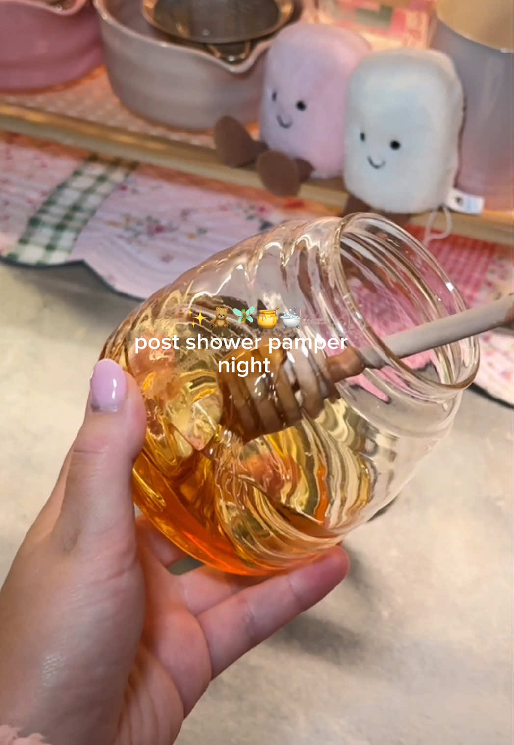 TikTok post by @by.emmaleah for Gisou. Caption reads: [...] Teezer detangler brush* @Gisou honey milk 5....