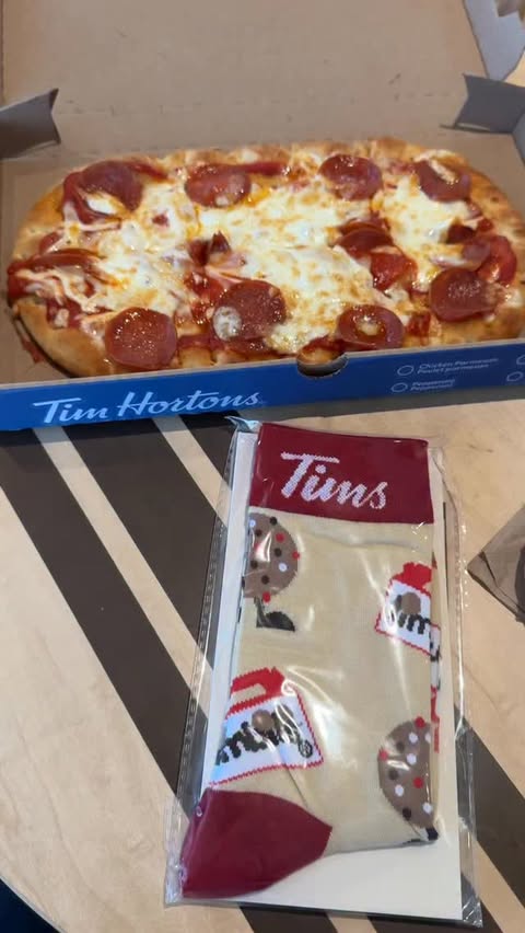 Instagram post by @livingonaloonie for Tim Hortons. Caption reads: @timhortons holiday meal deals! $14.99 includes a....