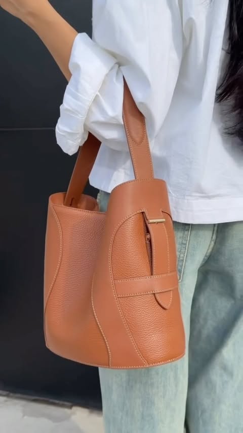 Instagram post by @hshadyyy for Etienne Aigner AG. Caption reads: A staple piece to any outfit - the Deborah bag....