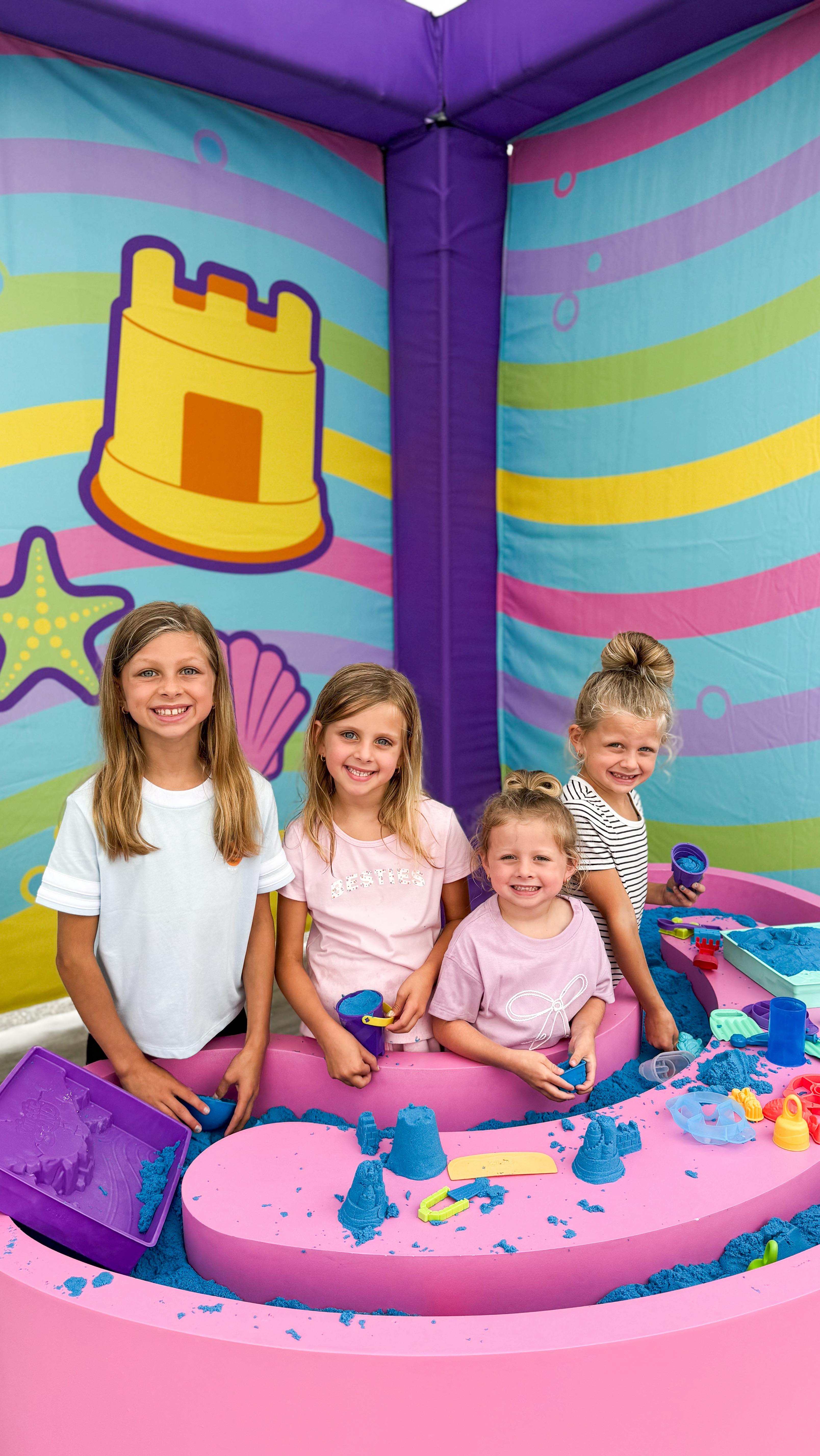 Instagram post by @happilyeveralbertson for Kinetic Sand. Caption reads: #ad We visited the @kineticsand Summer Flow Tour....