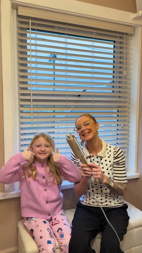 Instagram post by @jackiebakerx for TYMO Beauty. Caption reads: Curling her hair today and my heart right along....