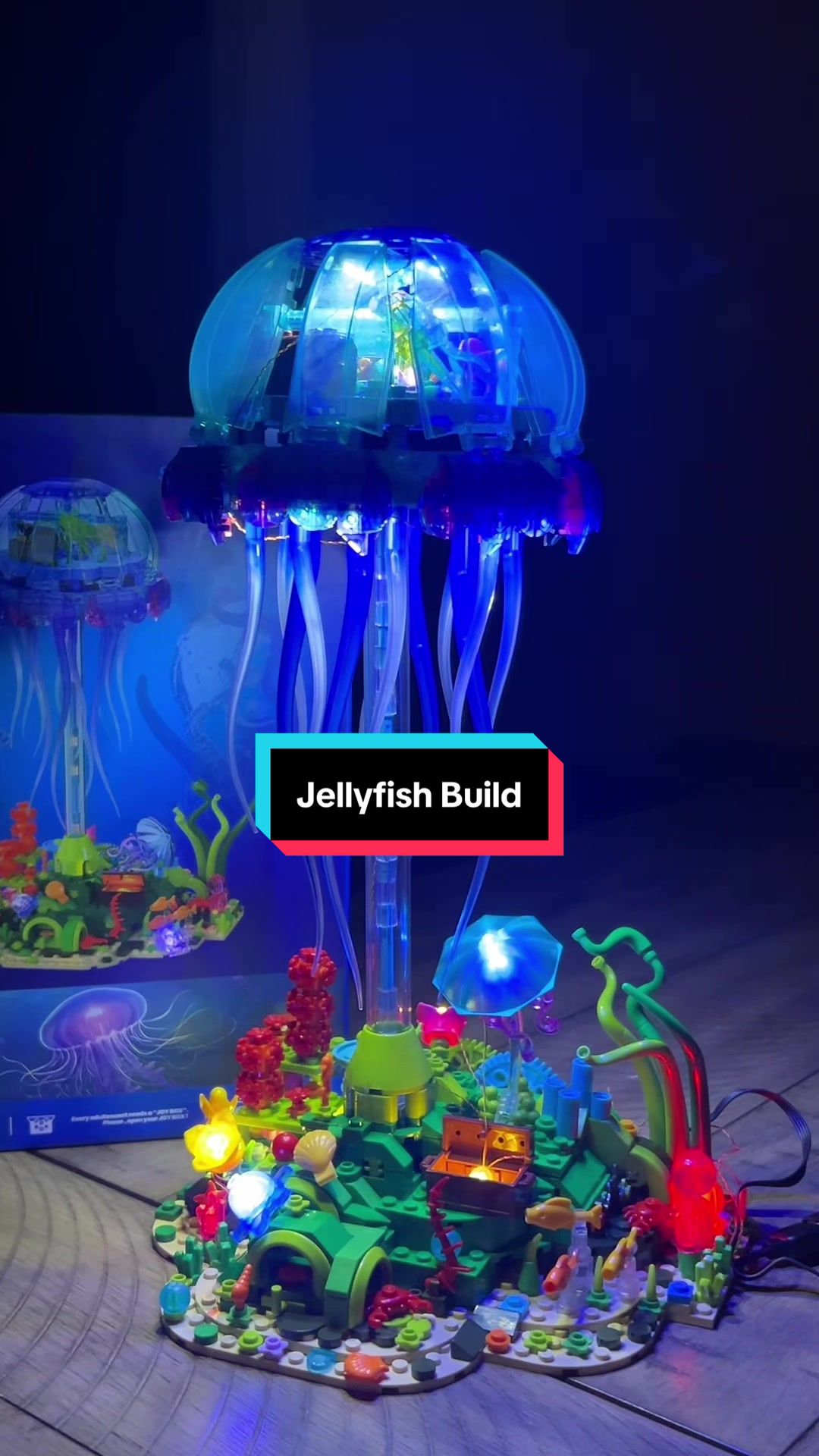 TikTok post by @karrottopo for Jmbricklayer. Caption reads: So Thankful for this incredible jellyfish building....