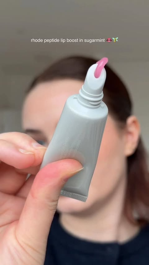Instagram post by an influencer for rhode skin. Caption reads: New @rhode peptide lip boost in sugarmint 🧚✨....